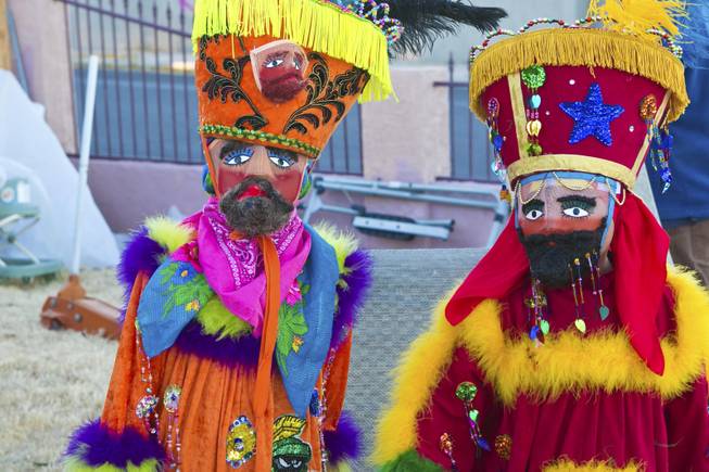 Two child Chinelos, dancers, from a local cultural dance troupe "Comparza Morelense" are costumed in traditional Morelos, Mexico dance costumes, Tuesday, Jan. 8, 2013. The troupe has been invited to perform at President Obama's inauguration parade on January 21.